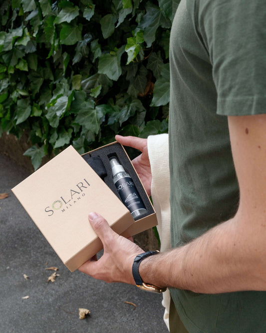 Person holding a SOLARI Milano gift box, featuring thoughtful products, ideal for the Best Vegan Gifts.